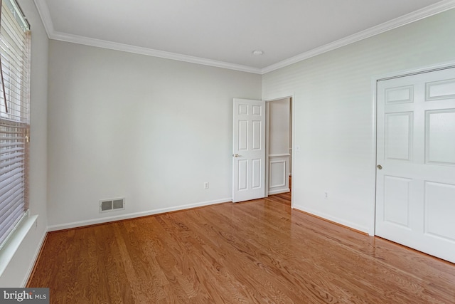 16453 Sparkling Brook Loop, Dumfries, VA 22025 - unfurnished bedroom featuring ornamental molding and wood finished floors