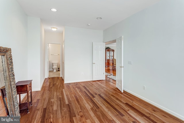 16453 Sparkling Brook Loop, Dumfries, VA 22025 - unfurnished bedroom with light wood finished floors, recessed lighting, and connected bathroom