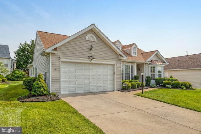 16453 Sparkling Brook Loop, Dumfries, VA 22025 - view of front of home featuring roof with shingles, driveway, a garage, and a front lawn