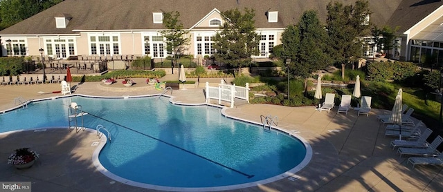 16453 Sparkling Brook Loop, Dumfries, VA 22025 - community pool with a patio