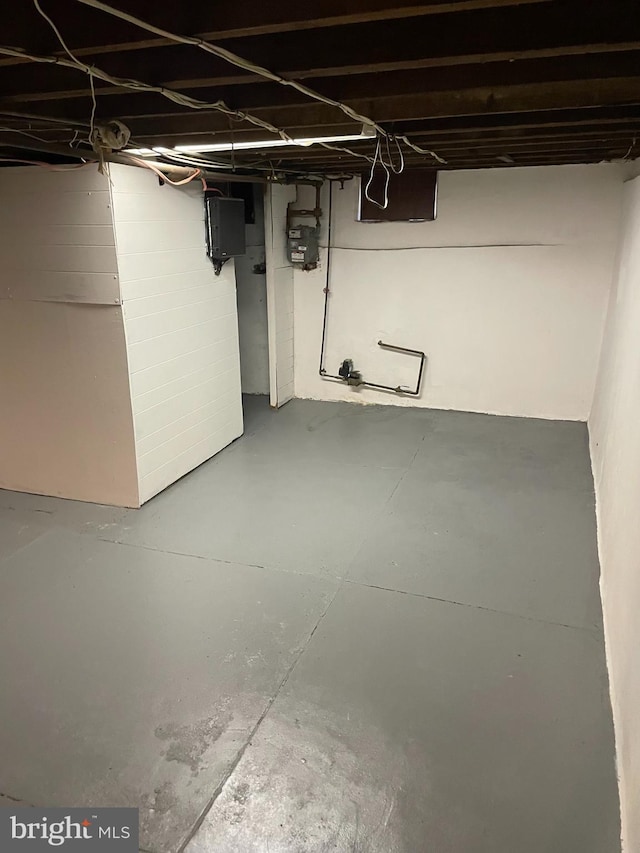 unfinished basement featuring gas meter