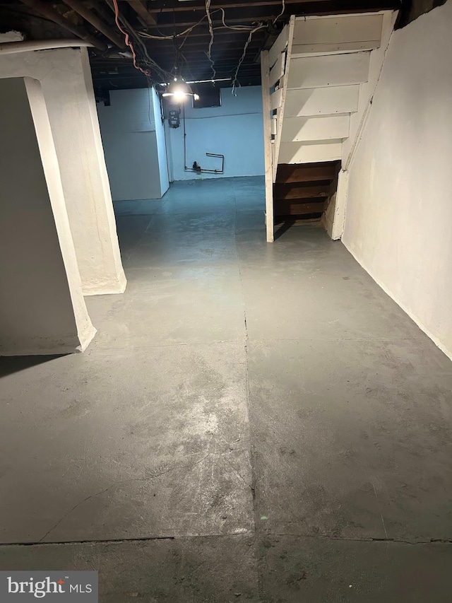 unfinished below grade area featuring stairs