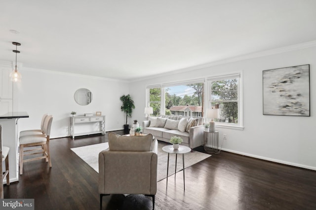 living room with ornamental molding, dark wood-style flooring, and baseboards
