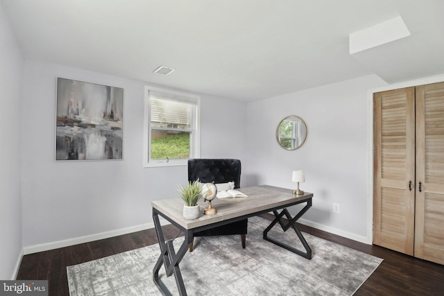 office space featuring baseboards and dark wood-style floors
