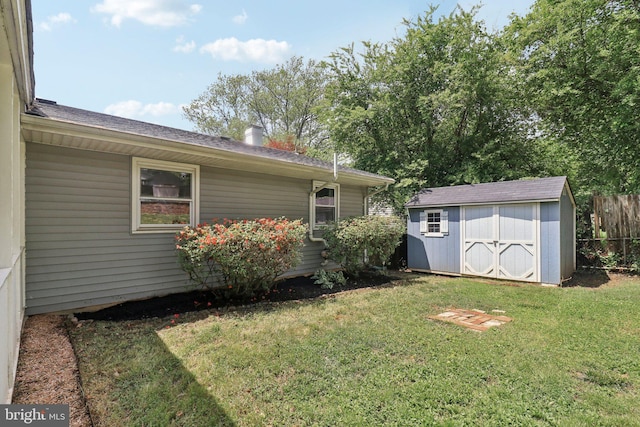 view of yard featuring a shed and an outbuilding