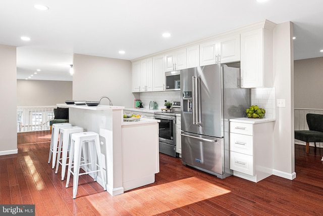 194 Black Cub Run Ln, Harpers Ferry, WV 25425 - kitchen with stainless steel appliances, dark wood-style floors, backsplash, and recessed lighting