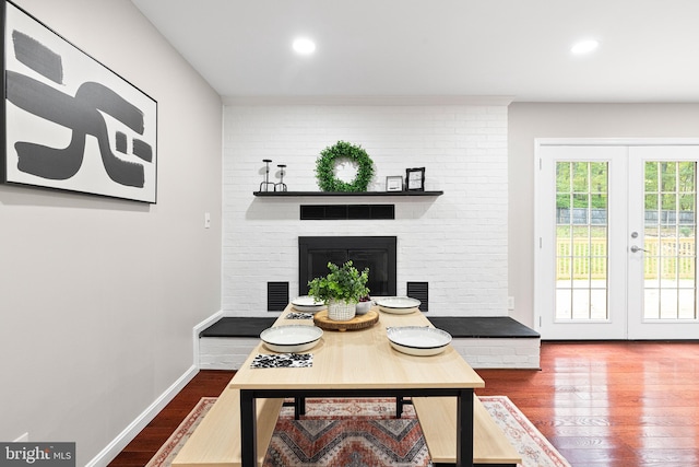 194 Black Cub Run Ln, Harpers Ferry, WV 25425 - dining space featuring wood finished floors, french doors, a fireplace, and recessed lighting
