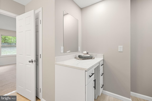 194 Black Cub Run Ln, Harpers Ferry, WV 25425 - bathroom with vanity, baseboards, and wood finished floors