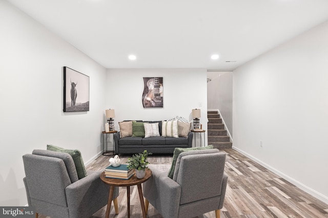 194 Black Cub Run Ln, Harpers Ferry, WV 25425 - living room featuring light wood-style floors, baseboards, recessed lighting, and stairs