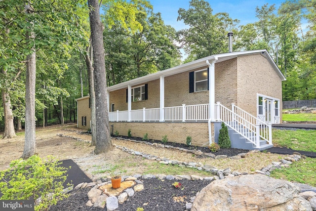 194 Black Cub Run Ln, Harpers Ferry, WV 25425 - view of front facade featuring brick siding and a porch