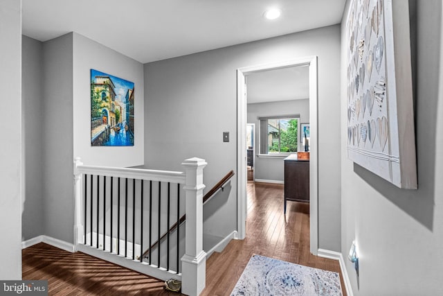 352 Paoli Woods Dr, Paoli, PA 19301 - hall featuring an upstairs landing, wood finished floors, baseboards, and recessed lighting