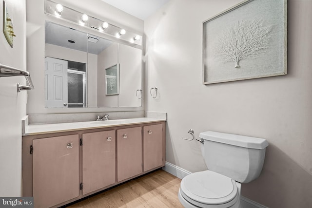 352 Paoli Woods Dr, Paoli, PA 19301 - full bathroom featuring baseboards, toilet, wood finished floors, vanity, and a shower with shower door