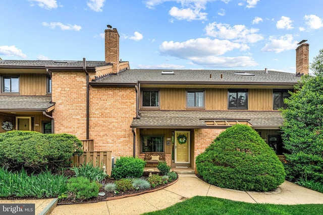 352 Paoli Woods Dr, Paoli, PA 19301 - view of front of house featuring a chimney, a shingled roof, and brick siding