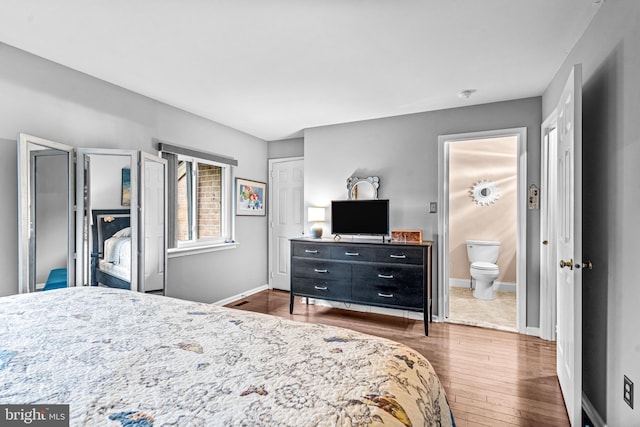 352 Paoli Woods Dr, Paoli, PA 19301 - bedroom featuring wood-type flooring, baseboards, and ensuite bath