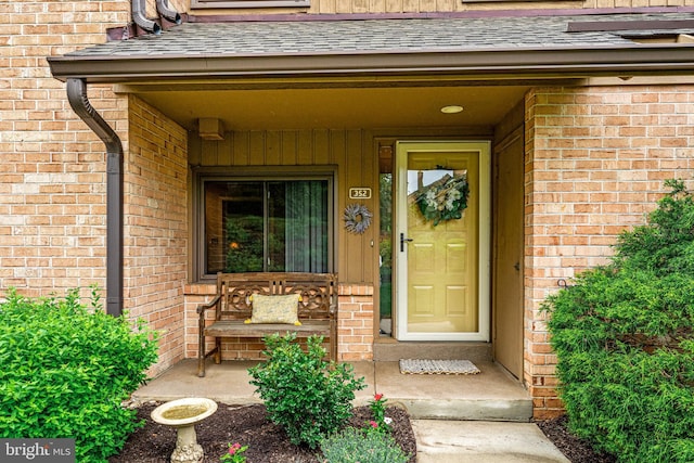 352 Paoli Woods Dr, Paoli, PA 19301 - entrance to property with brick siding, covered porch, and a shingled roof