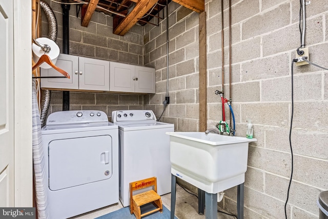 352 Paoli Woods Dr, Paoli, PA 19301 - clothes washing area featuring washing machine and dryer, concrete block wall, and cabinet space
