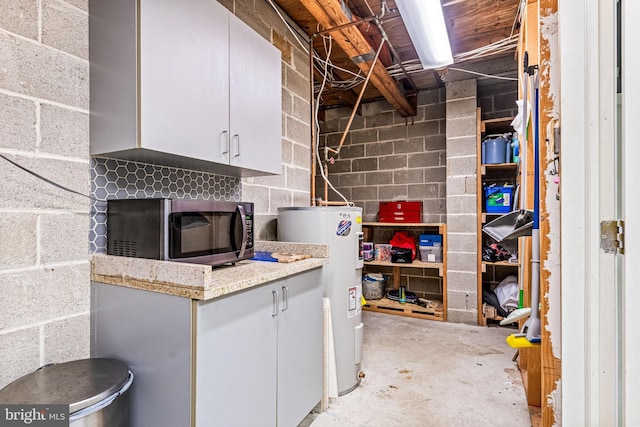352 Paoli Woods Dr, Paoli, PA 19301 - unfinished below grade area featuring water heater and concrete block wall