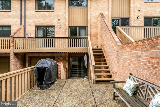 352 Paoli Woods Dr, Paoli, PA 19301 - back of property featuring stairway, brick siding, and a balcony