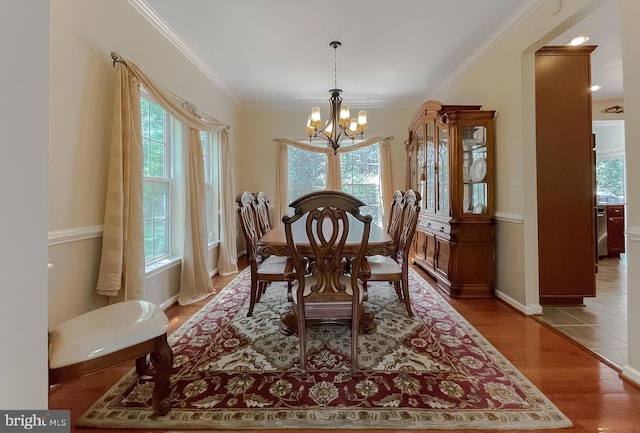 13605 Sugar Mill Ct, Waldorf, MD 20601 - dining area with a chandelier, plenty of natural light, ornamental molding, and wood finished floors