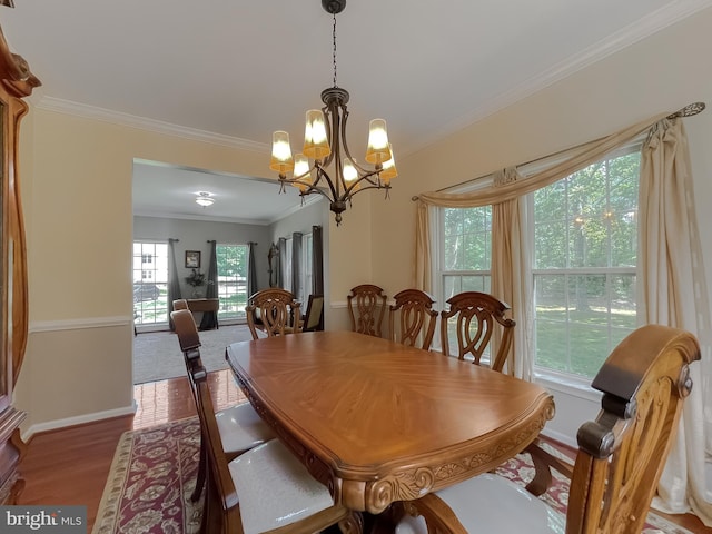 13605 Sugar Mill Ct, Waldorf, MD 20601 - dining space with a chandelier, ornamental molding, wood finished floors, and baseboards