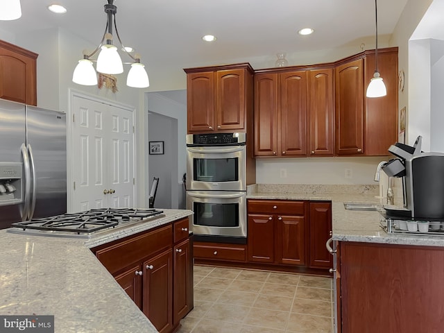 13605 Sugar Mill Ct, Waldorf, MD 20601 - kitchen with stainless steel appliances, a sink, decorative light fixtures, light stone countertops, and recessed lighting