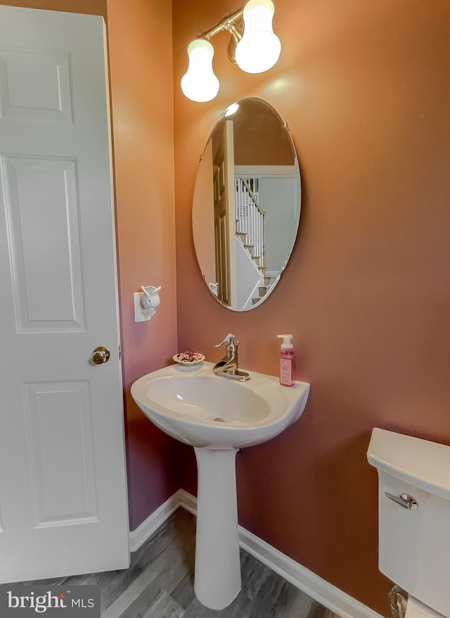 13605 Sugar Mill Ct, Waldorf, MD 20601 - bathroom with toilet, wood finished floors, and baseboards