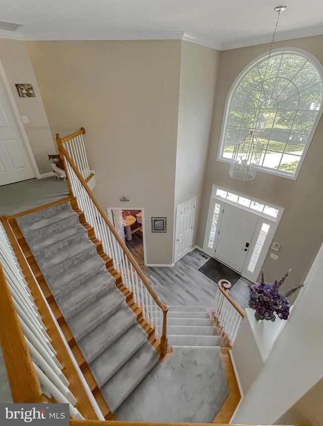 13605 Sugar Mill Ct, Waldorf, MD 20601 - entrance foyer with stairs, baseboards, ornamental molding, and a towering ceiling