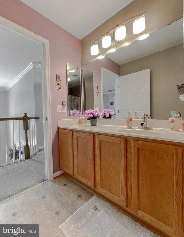 13605 Sugar Mill Ct, Waldorf, MD 20601 - bathroom featuring double vanity, crown molding, and tile patterned flooring