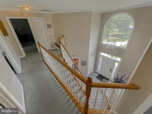 13605 Sugar Mill Ct, Waldorf, MD 20601 - foyer with a chandelier, baseboards, crown molding, and carpet floors