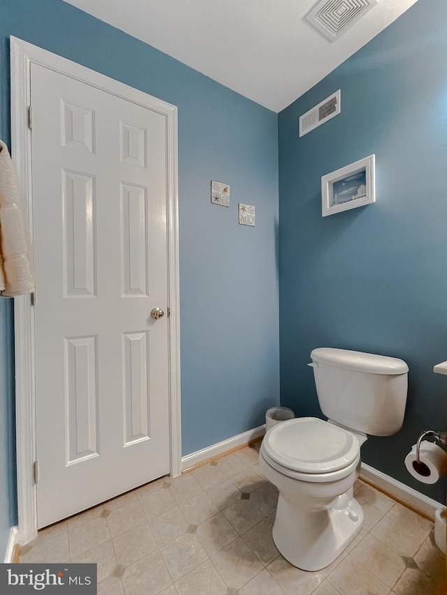 13605 Sugar Mill Ct, Waldorf, MD 20601 - bathroom featuring toilet, baseboards, and tile patterned flooring