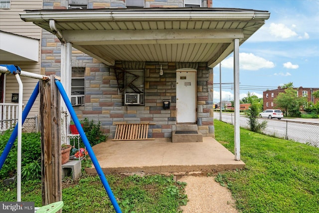 28 Talbott St, Baltimore, MD 21225 - doorway to property featuring stone siding