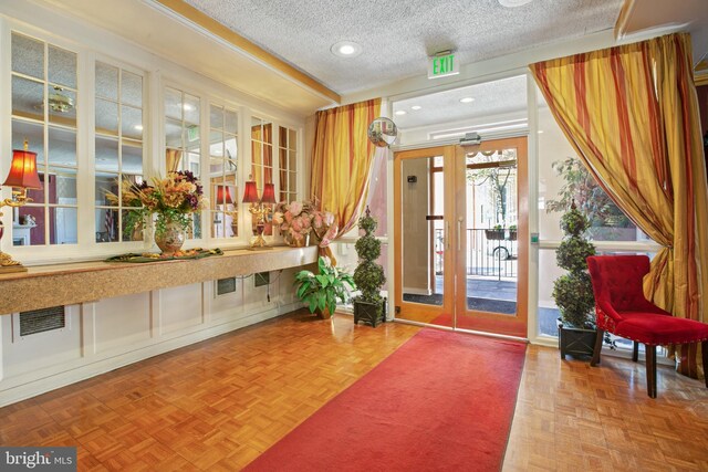 1001 Saint Paul St Unit 9F, Baltimore, MD 21202 - building lobby featuring a textured ceiling