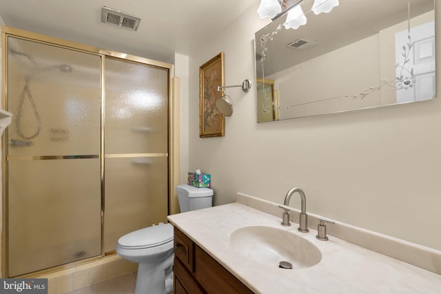 full bath with a shower stall, toilet, vanity, and tile patterned flooring