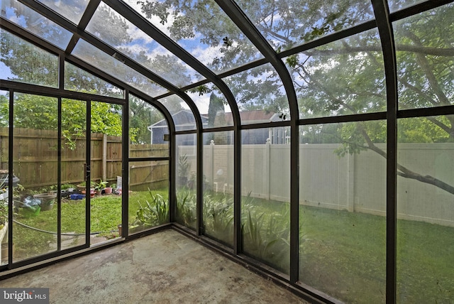 unfurnished sunroom with vaulted ceiling