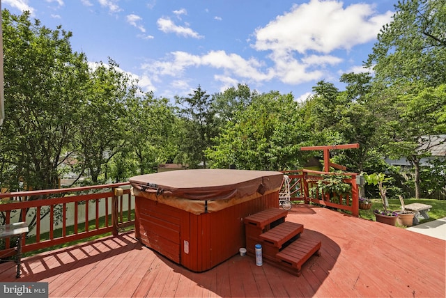 deck with a hot tub