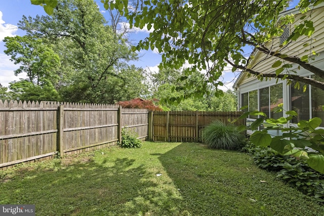view of yard with a sunroom
