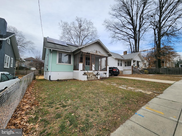 2838 27th St NE, Washington, DC 20018 - bungalow with a porch and roof mounted solar panels