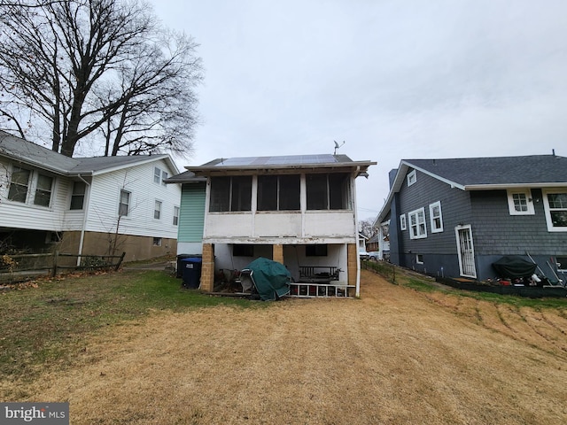 2838 27th St NE, Washington, DC 20018 - rear view of property with a sunroom and a yard