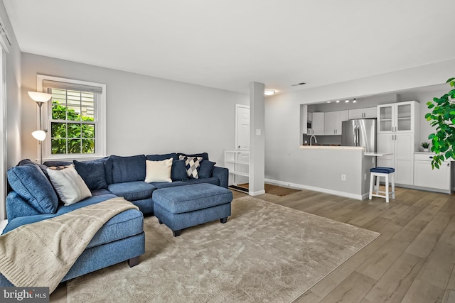 2224 Springwood Dr Unit 102A, Reston, VA 20191 - living area featuring wood finished floors and baseboards