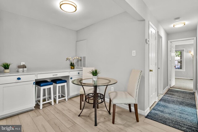 2224 Springwood Dr Unit 102A, Reston, VA 20191 - dining room featuring light wood-style flooring and baseboards