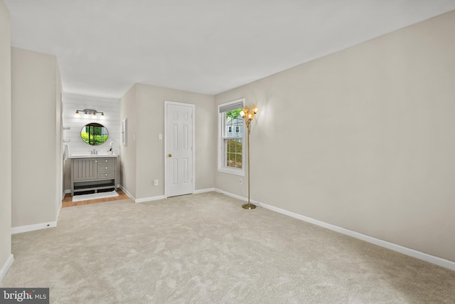 2224 Springwood Dr Unit 102A, Reston, VA 20191 - unfurnished bedroom with baseboards, light carpet, and ensuite bathroom