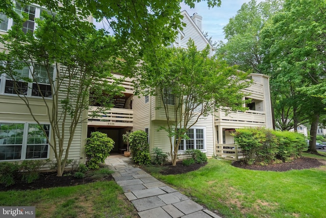 2224 Springwood Dr Unit 102A, Reston, VA 20191 - view of front of house featuring a balcony and a front lawn