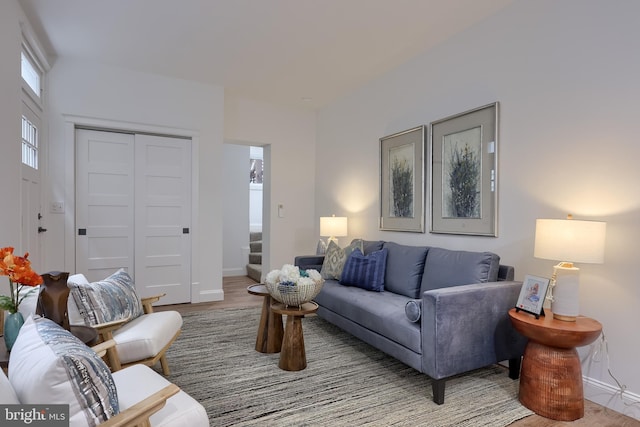 living area featuring baseboards