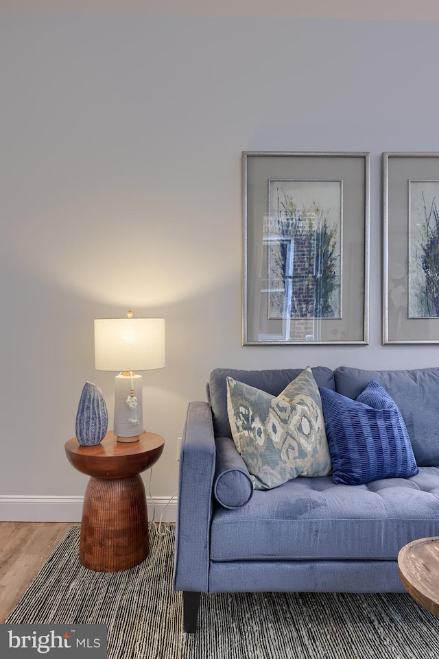 living room with wood finished floors and baseboards