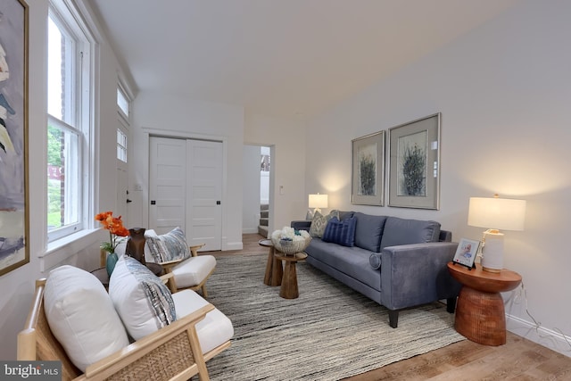 living room featuring wood finished floors and baseboards