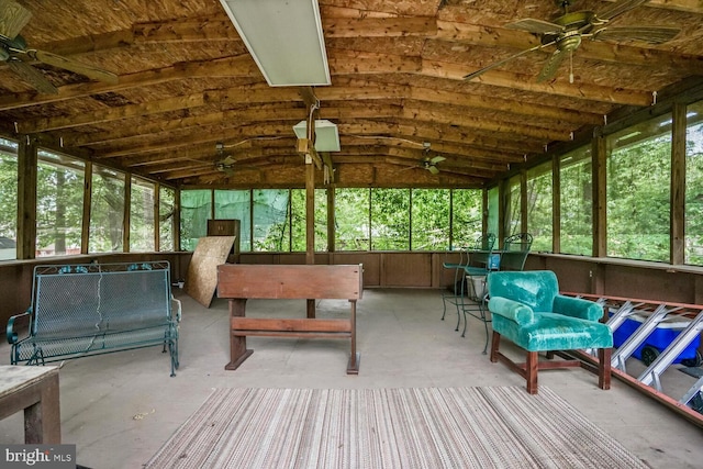 sunroom / solarium with a ceiling fan and lofted ceiling