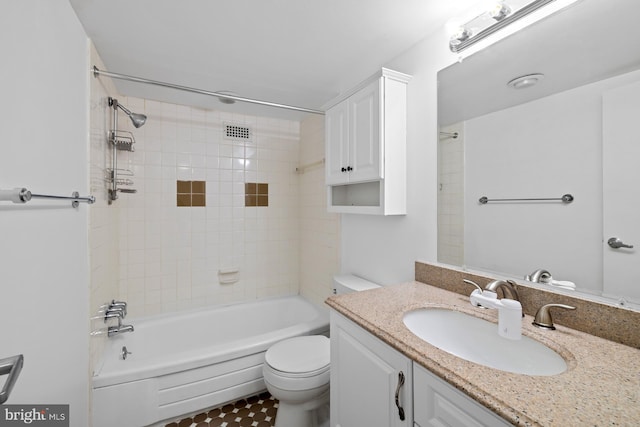 full bath with toilet, vanity, and bathing tub / shower combination
