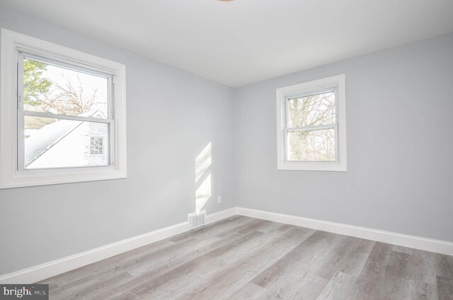 7009 Adelphi Rd, Hyattsville, MD 20782 - empty room with wood finished floors and baseboards