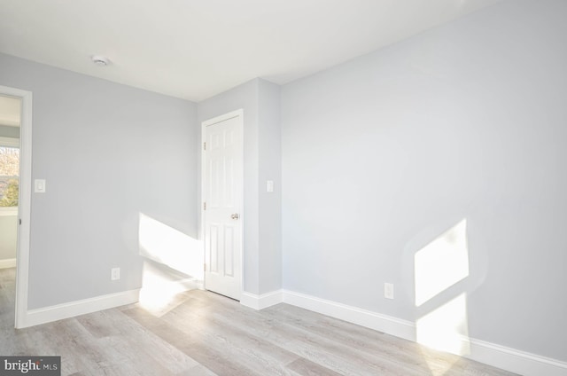 7009 Adelphi Rd, Hyattsville, MD 20782 - unfurnished bedroom featuring wood finished floors and baseboards