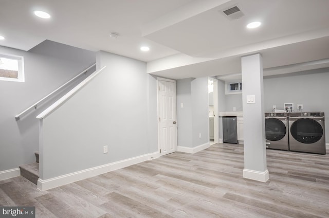 7009 Adelphi Rd, Hyattsville, MD 20782 - below grade area featuring washing machine and dryer, light wood-style floors, baseboards, and recessed lighting
